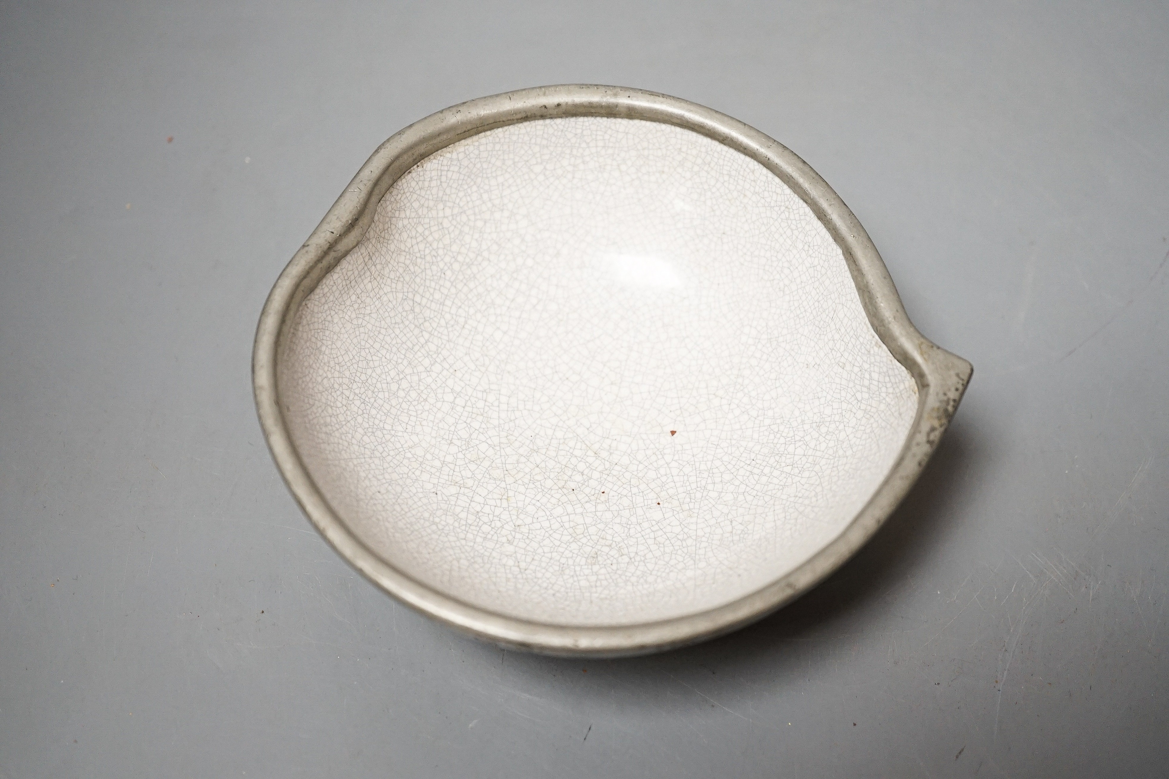 A Chinese Yixing pottery and pewter mounted peach shaped cup, late 19th century, length 13cm